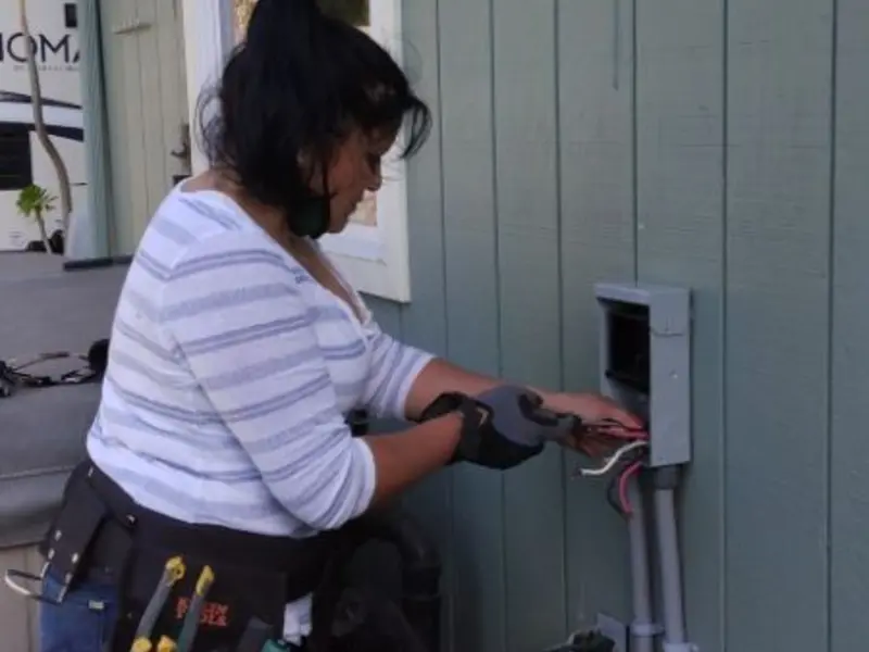 Licensed electrician wiring an exterior subpanel in Nantucket