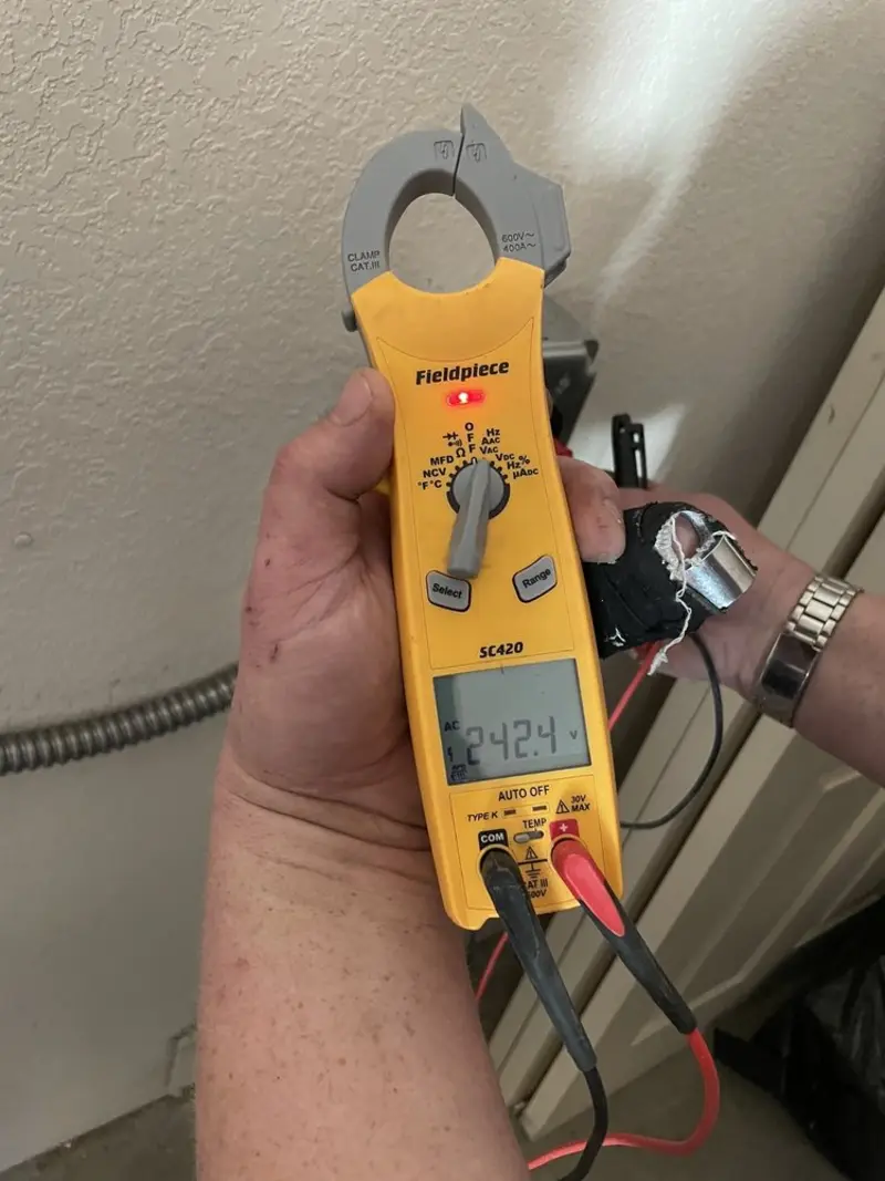 Voltage testing with clamp meter during Outlet Installation in Nantucket